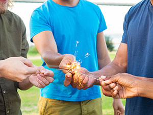 Man holds burning sparkler