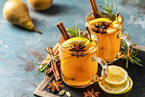 herbal tea with slices of oranges and a cinnamon stick